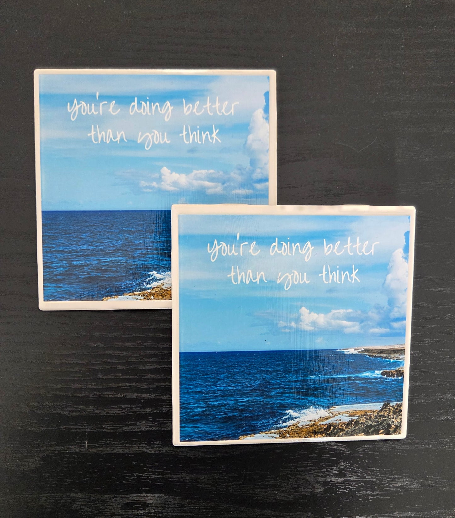 Handcrafted set of 4 individual 4"x4” ceramic tile coasters featuring original designs/uplifting messages. Sealed, durable, and perfect for everyday use/gifting.